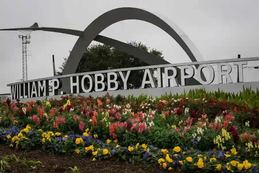 The main entrance of William P. Hobby Airport (HOU), clearly displays its name, symbolizing airport transfer services from Houston to Galveston.